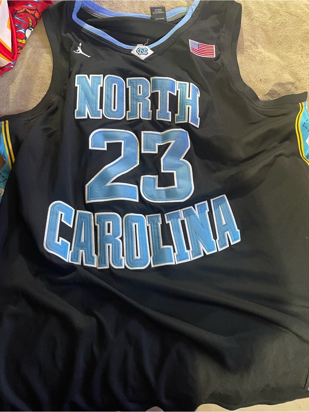 Jordan Black Jersey with Carolina Blue Number 23